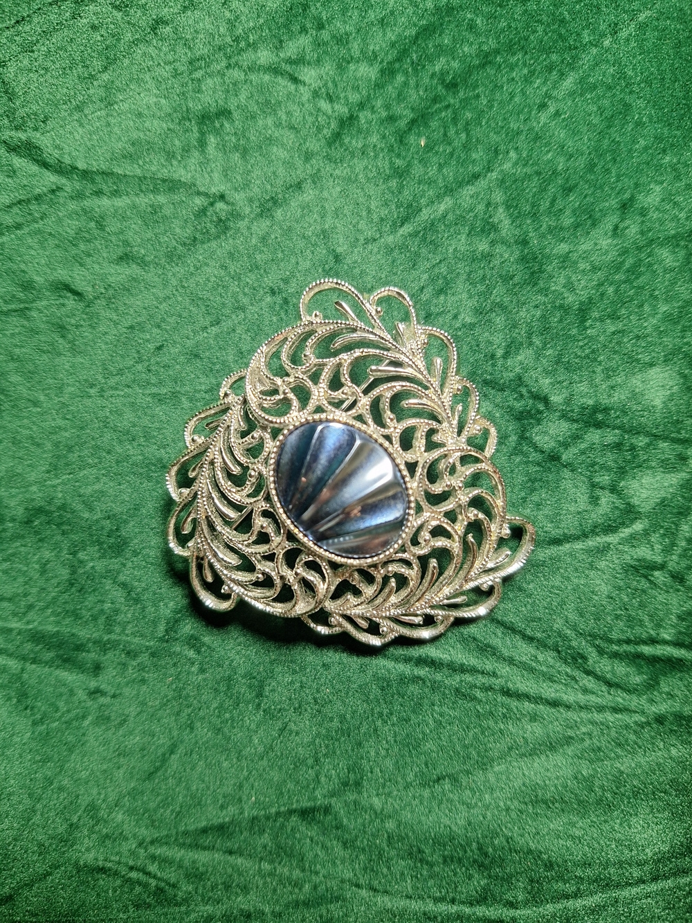 Vintage Sarah Cov Silver tone Filigree Brooch with Iridescent blue center